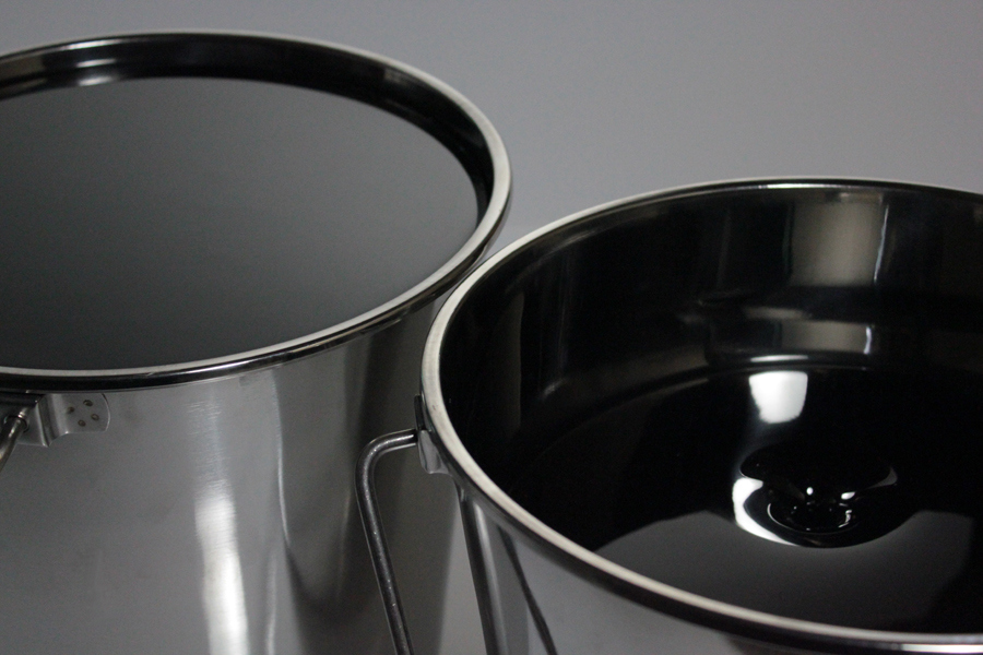 Untitled I and II. Fused glass looking like black oil in stainless steel buckets