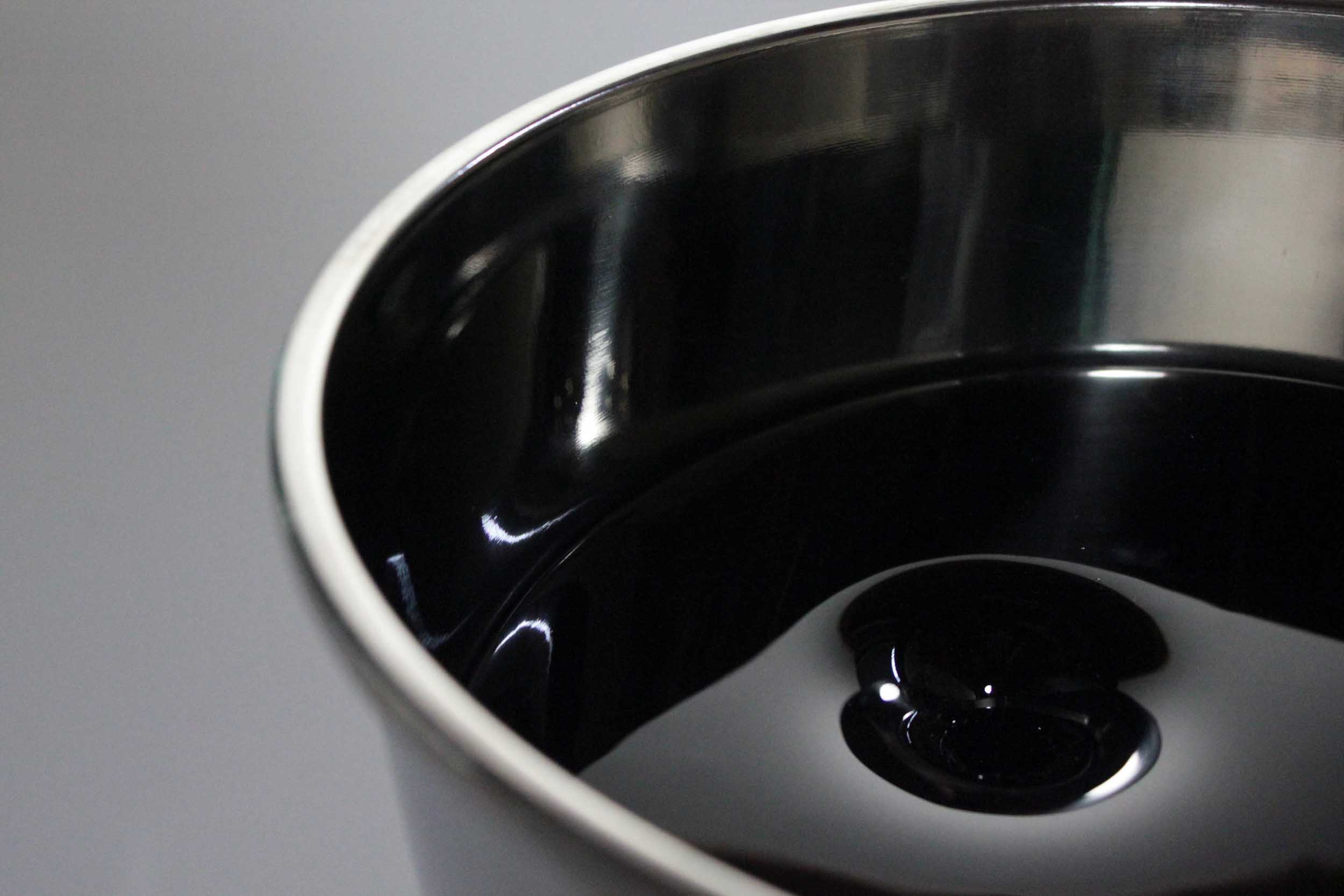 Untitled II. Fused glass looking like black oil in stainless steel buckets
