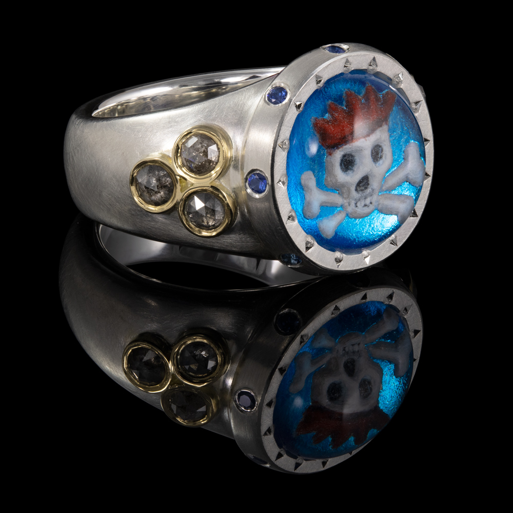 image showing sterling silver ring with 18ct highlights, rose cut diamonds and a showcase gem with a skull wearing a red hat